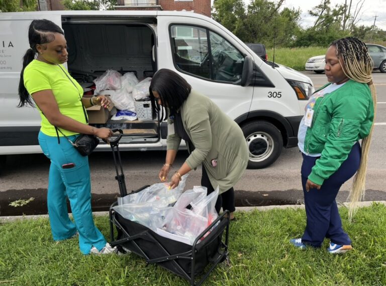 chw, nurses giving out storm supplies