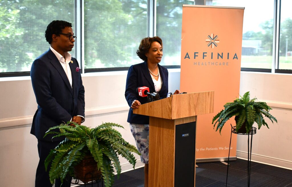 cong wesley bell and dr holmes at press conference medicaid